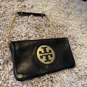 Tory Burch “Reva” Logo Clutch Flap Bag black leather and gold hardware.